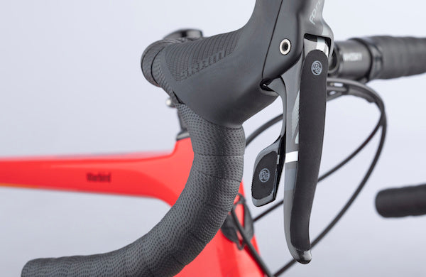 Closeup view of a bike drop bar shift/brake lever with lever grippies.