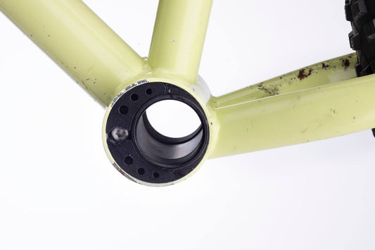 Closeup view of a bike frame with a bushnell bottom bracket installed.