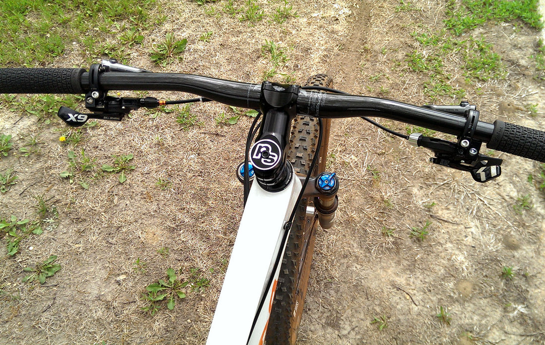 A rider's view of the the handlebars on a bike with shifters mounted